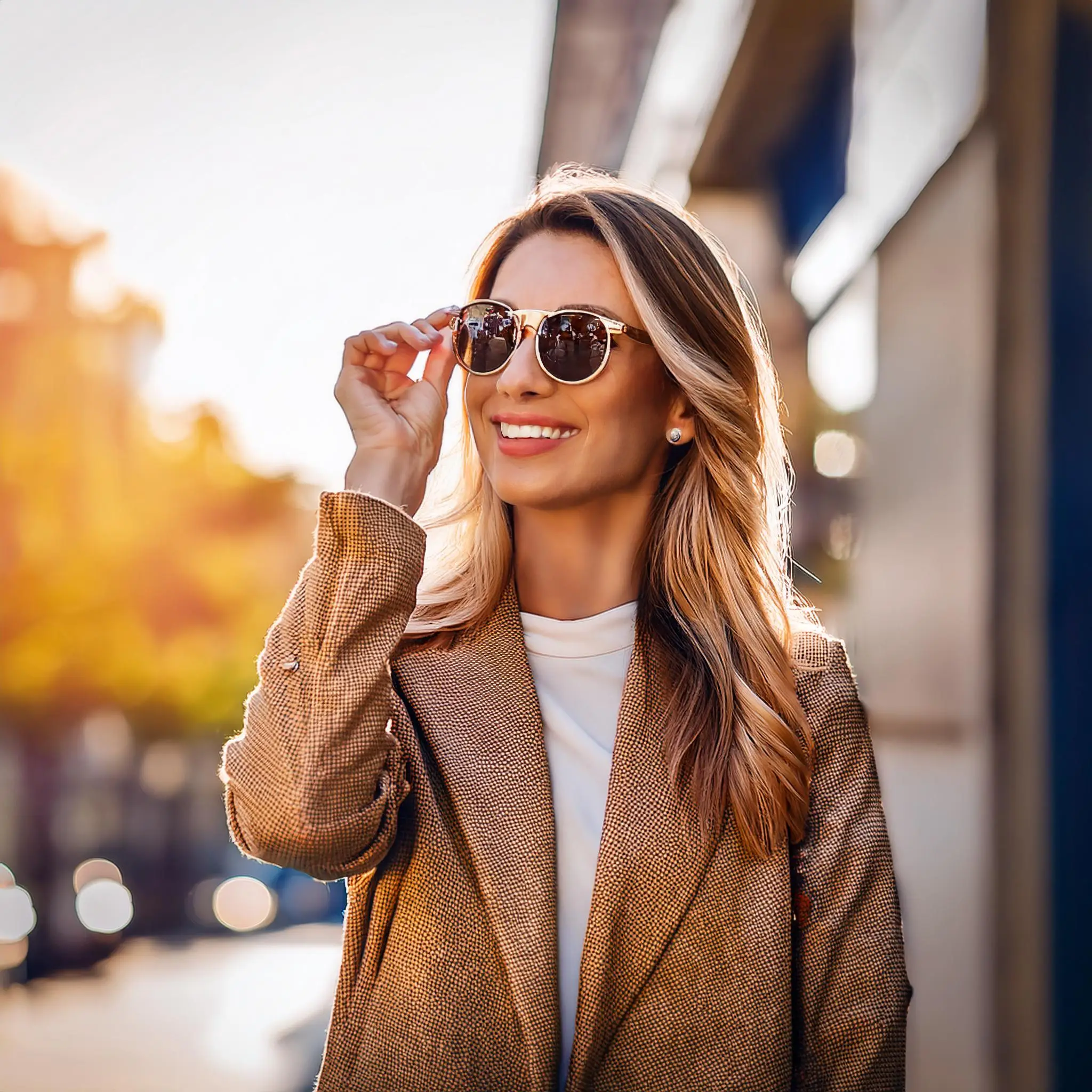 Firefly A customer trying on stylish sunglasses with UV protection looking confident and happy outd 1 Optometrist Services in Conestogo Ontario