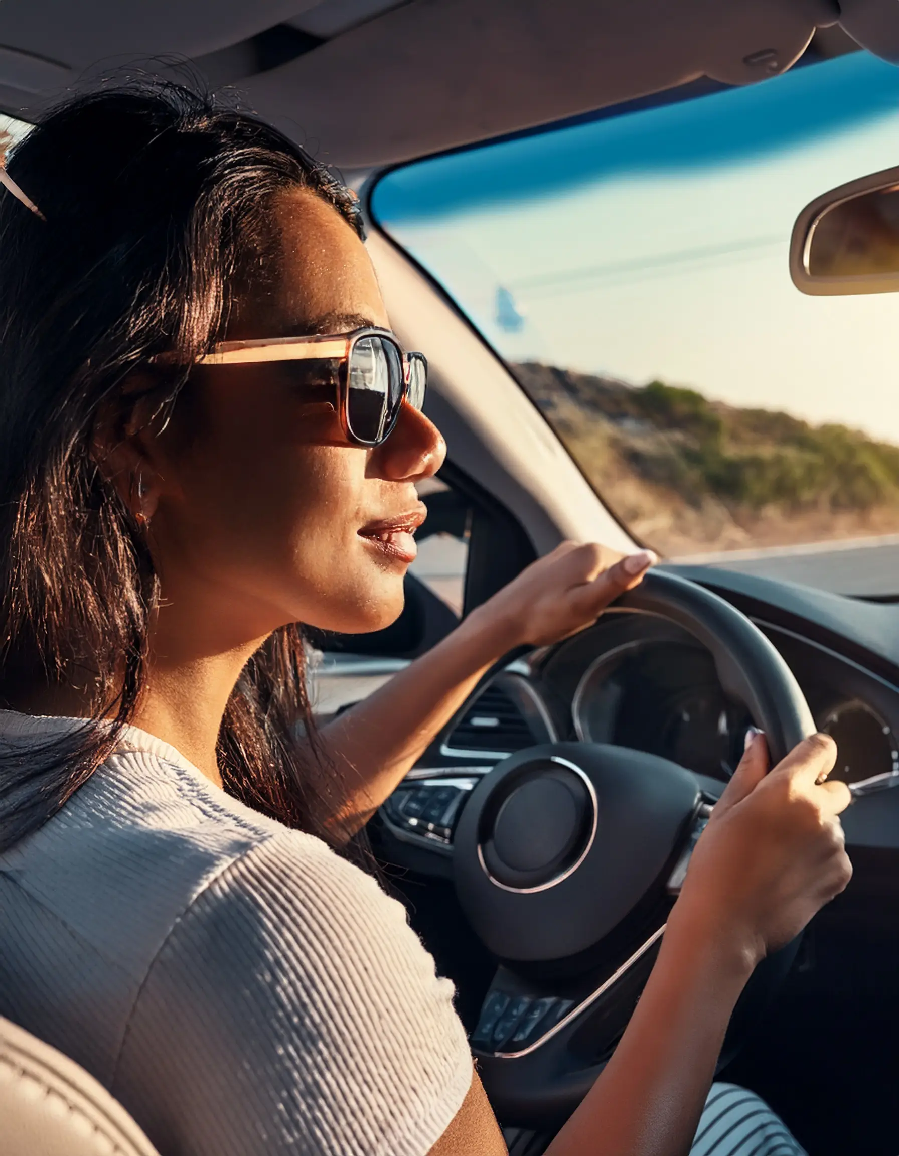 Firefly A driver wearing polarized sunglasses with a clear road ahead and reduced glare from the da Polarized Sunglasses in Waterloo, Ontario