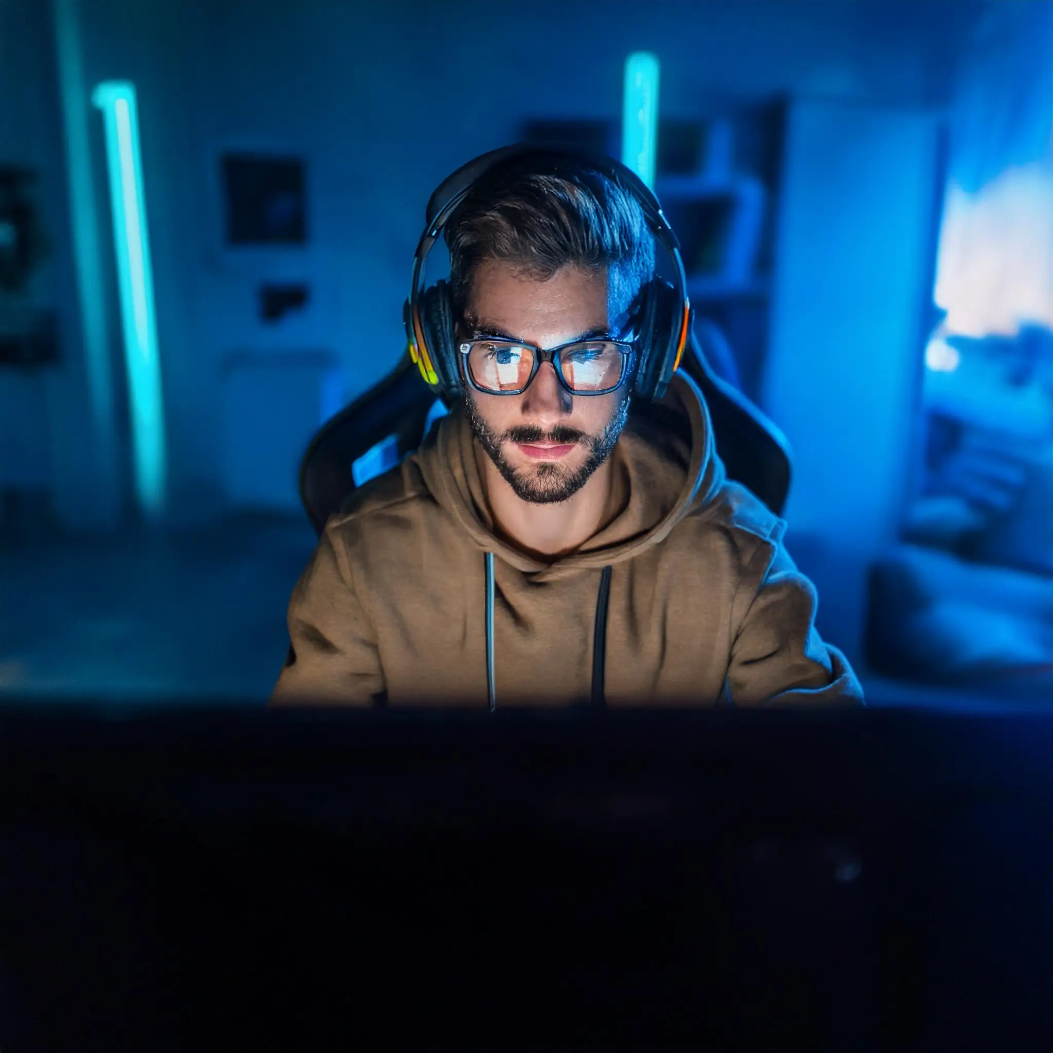 Firefly A gamer in a dimly lit room wearing computer glasses while immersed in a game. 46732 Computer Glasses