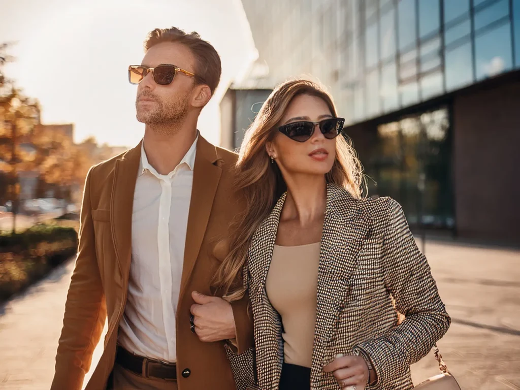 Firefly A stylish man and woman wearing designer prescription sunglasses on a sunny day in Waterloo,